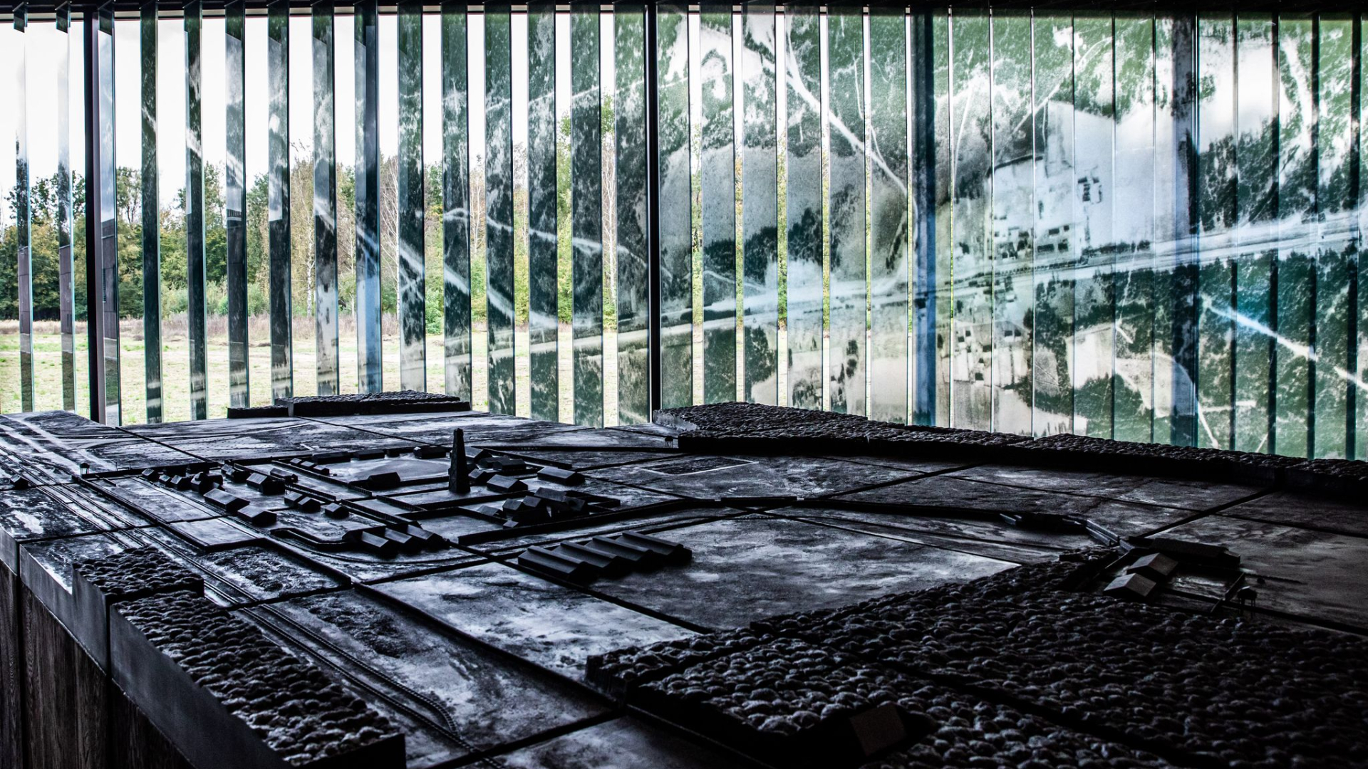 A detailed architectural model of the camp, made from black epoxy resin.